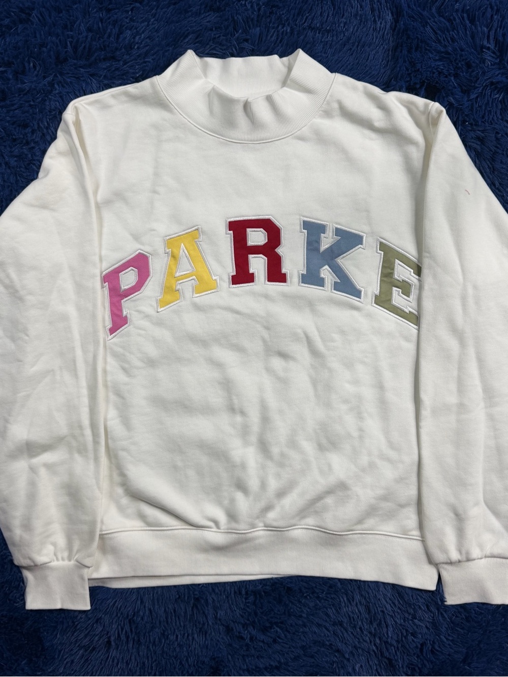 Parker White Turtleneck Sweatshirt with Multicolor Letter Appliqués